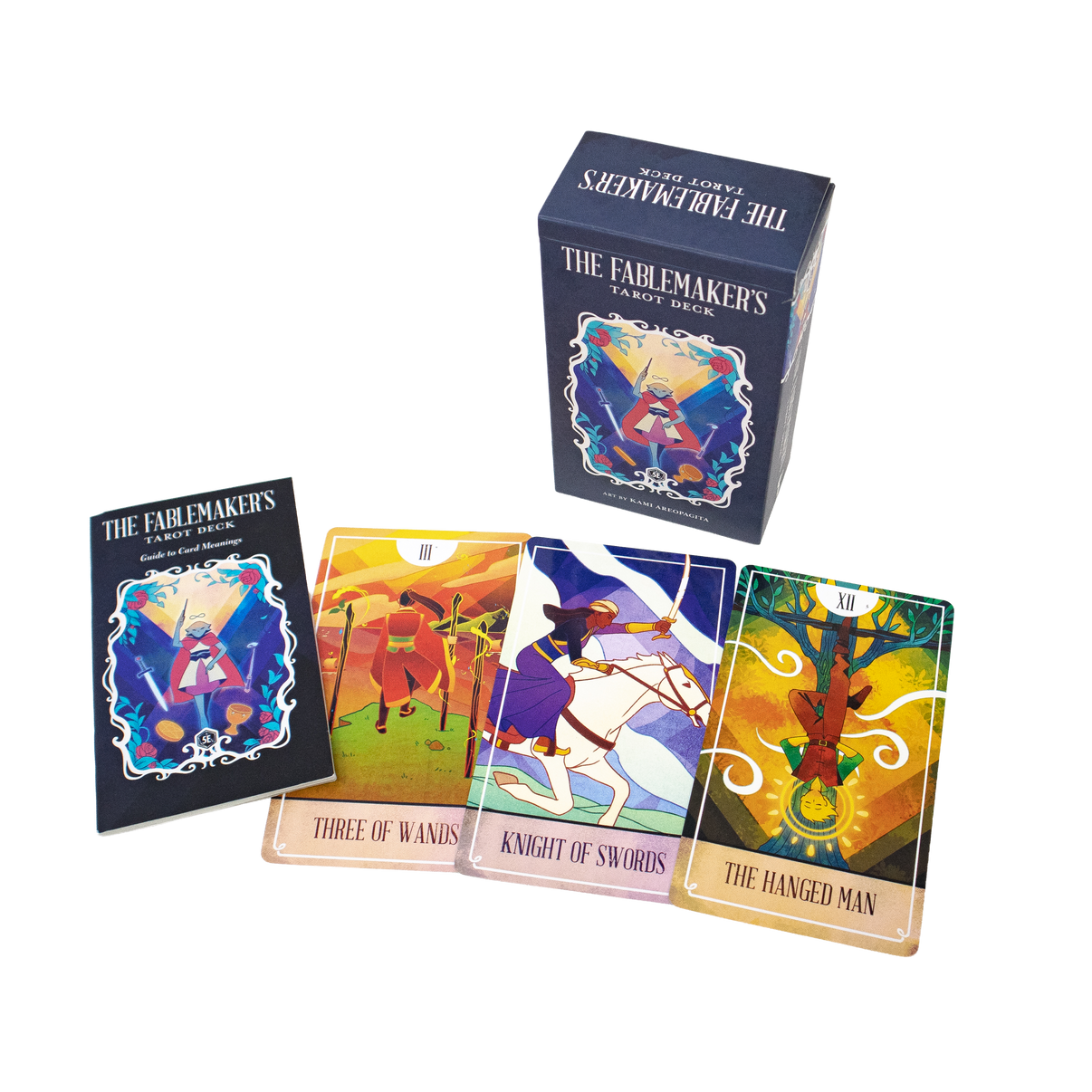 A photo of the Fablemakers Tarot Deck with the Three of Wands, the Knight of Swords and the Hanged Man cards laid out.